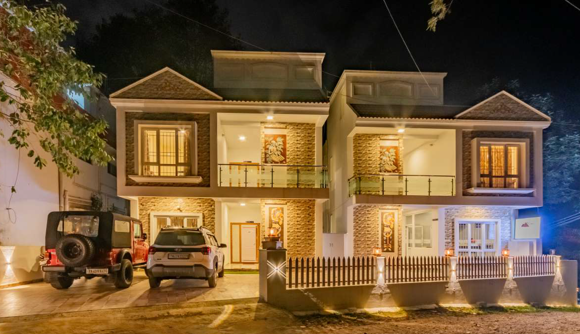 Front view of HESEGA Hotels & Resorts in Ooty, lit up at night