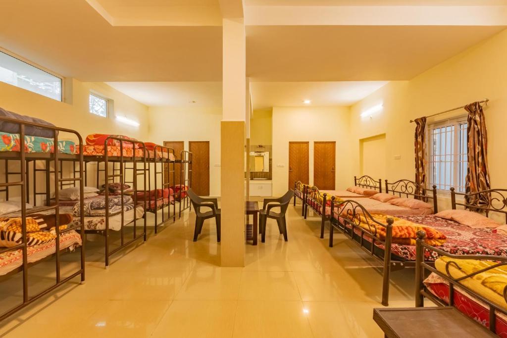 30 m² dormitory hall with single beds at HESEGA Hotels & Resorts, Ooty